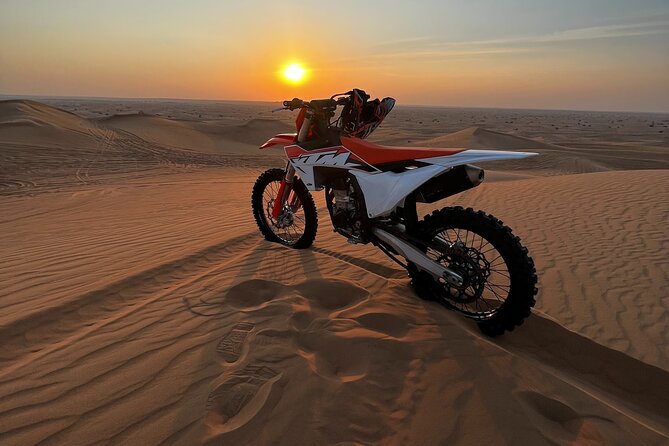 1-Hour KTM 450CC Dirt bike Desert Adventure Tours in Dubai - Getting fitted with the KTM and safety equipment