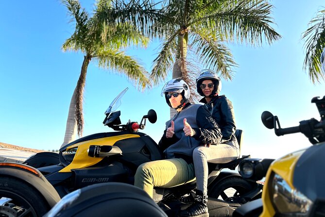3 wheels motorcycle Coast Tour - Ryker - Gran Canaria Maspalomas - Puerto Rico: a moving view of a resort center