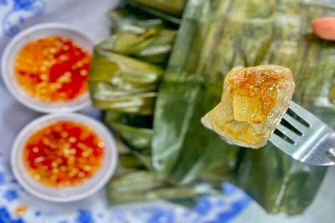 Da Nang Food Tour Motorbike & Sightseeing By Ao Dai Lady Rider - Love Bridge, your first riverside stop