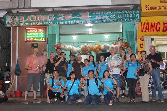 Food Tour by motorbike with local students - Betel-leaf beef with a local beer