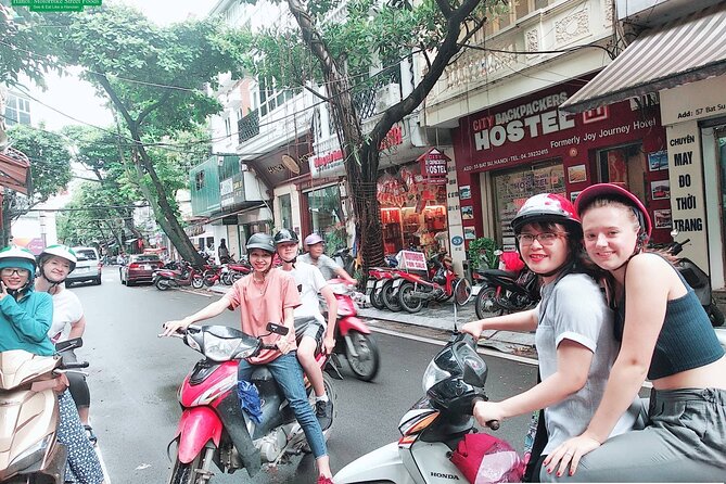 Hanoi Nightlife Food Tour By Motorbikes - Long Bien Bridge and Hanoi’s evening landmarks