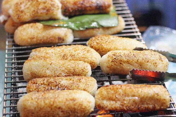 Ho Chi Minh City Street Food Tour & Sightseeing By Motorbike - Cambodian Market for local flavors and crunchy snacks