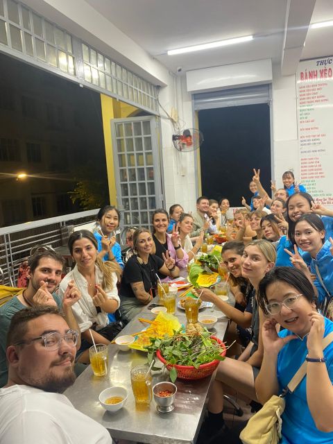 KISSTOUR| Saigon By Night & Street Food Tour on Motorbike - Crossing from older Saigon to the modern riverside