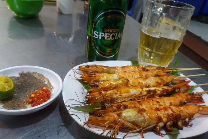 Saigon After Dark and Street Food by Motorbike and Scooter - Flowers, fashion, and the changing city after dark
