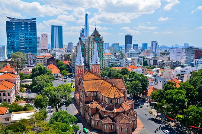 Small group Saigon Inside Out by Motorbike for 3 Hours - A market, local food, and a drink