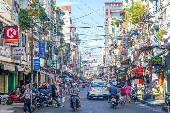 Small group Saigon Inside Out by Motorbike for 3 Hours - Passing the Saigon theater area